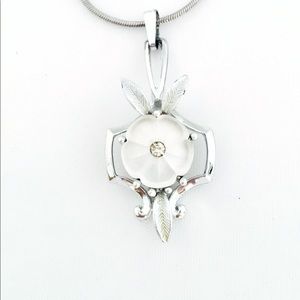 Vintage pendant on new sterling plated chain.